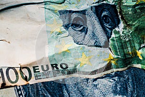 Benjamin Franklins face peeking out of a hole in a 100 euro banknote