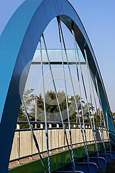 The bent blue ark of the iron bridge