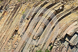 Bent hexagonal columns of volcanic origin at the Hong Kong Global Geopark in Hong Kong, China.