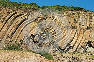 Bent hexagonal columns of volcanic origin at the Hong Kong Global Geopark in Hong Kong, China.