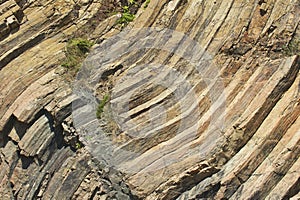 Bent hexagonal columns of volcanic origin at the Hong Kong Global Geopark in Hong Kong, China.