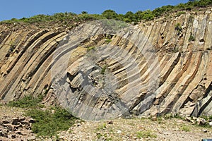 Bent hexagonal columns of volcanic origin at the Hong Kong Global Geopark in Hong Kong, China.