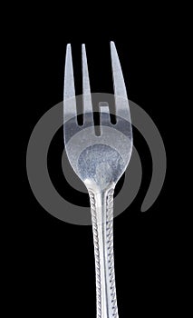 Bent metal fork, one teeth down.