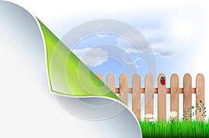 Bent paper and spring countryside with wooden fence