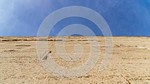 The Bent Pyramid is an ancient Egyptian pyramid located at the royal necropolis of Dahshur, approximately 40 kilometres south of