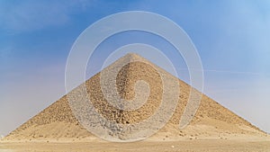 The Bent Pyramid is an ancient Egyptian pyramid located at the royal necropolis of Dahshur, approximately 40 kilometres south of