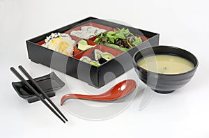 Bento Box With Miso Soup and Chopsticks