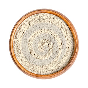 Bentonite, medicinal clay, montmorillonite powder, in a wooden bowl photo