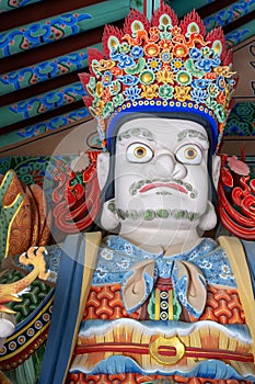 Beomeosa temple guard. A colorful painted statue in Busan, South Korea. photo