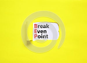 BEP break even point symbol. Concept words BEP break even point on white paper on a beautiful yellow background. Business and BEP