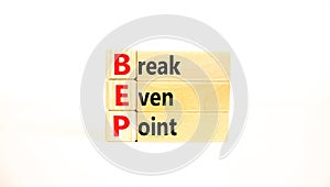 BEP break even point symbol. Concept words BEP break even point on wooden blocks on a beautiful white table white background.