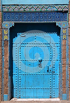 Berber blue Moroccan riad door and frame photo