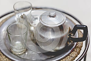 Berber man offers traditional mint tea to guest in Marrakesh