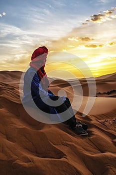 Berber man at sunset in the Sahara desert of Merzouga, Morocco