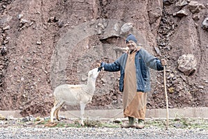 Berber shepherd with his sheep in remote High Atlas mountain