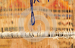 Berber woman weaving a carpet in medina souke in Marrakesh