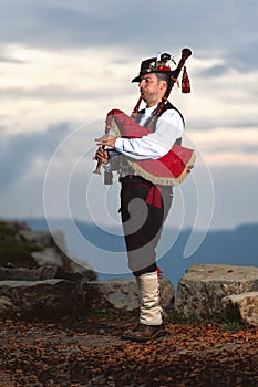 Bergamo Bagpipe. Player with traditional costume