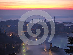 Bergamo, Italy. Lombardy. Amazing landscape of the fog rises from the plains and covers the old town