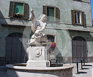 Bergamo, Italy, The Old city. The dolphin fountain in Pignolo street