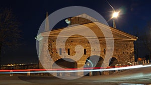 Bergamo, the old city. Landscape on the old gate named San Giacomo door during the evening with trails of headlights