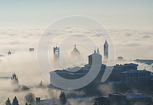 Bergamo, Italy. Lombardy. Amazing landscape of the fog rises from the plains and covers the old town