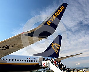2019.09.30 Bergamo, Orio al Serio airport Ryanair plane in the foreground with passengers who board the plane in the back