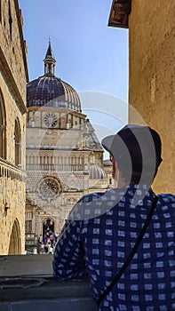 Bergamo - Rear view of tourist man looking at Colleoni Chapel (Cappella Colleoni), Lombardy