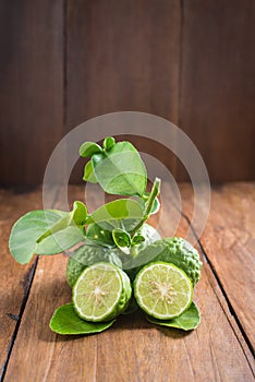 Bergamot with green leafs on wood background