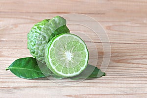 The Bergamot with green leafs on wood background