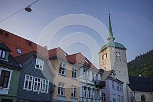 Bergen Cathedral in the City of Bergen, Norway is illumnated by a summer sunset