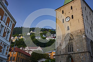 Bergen Cathedral in the City of Bergen, Norway is illumnated by a summer sunset