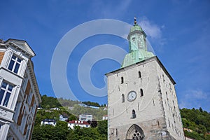 Bergen Cathedral in the City of Bergen, Norway is illumnated by a summer sunset