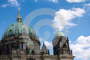 Berlin Cathedral. Light blue dome with gold appliquÃ©s. Celestial sky with white pompous clouds