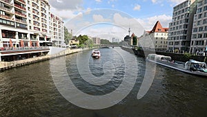 Berlin city skyline at Museum island and Berlin TV Tower, Tourist ship on River Spree