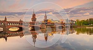 Berlin city skyline at Oberbaum Bridge and Spree River in Germany