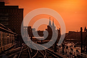 Berlin Cityscape during sunset with train over Oberbaum Bridge between Kreuzberg and Friedrichshain