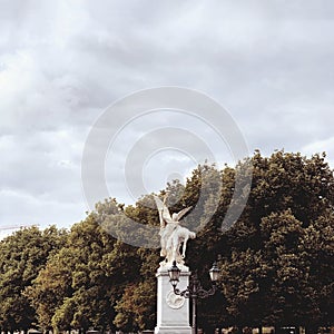 Berlin, Germany - 20 june 2019: a statue of a winged angel in a park