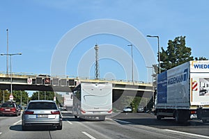 Scene on the Berlin freeway A100 with different vehicles and the Berlin Radiotower in the background