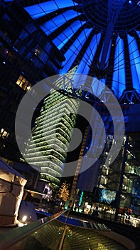 BERLIN, GERMANY - JAN 17th, 2015: Close up of blue lit roof structure of Sony Center at night, showing strong