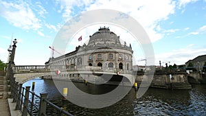 BERLIN - GERMANY, MAY 23, 2017, Bode museum in sunny day with pleasure boat on Spree river on blue sky background. River Island
