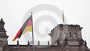 Berlin.Germany. Parliament of the Bundestag and the developing German flag