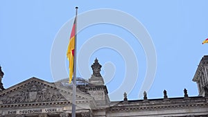 Berlin.Germany. Parliament of the Bundestag and the developing German flag