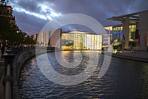 Berlin, Germany, the Spree at night, the riverside of the modern buildings at night under the lights more concise and powerful