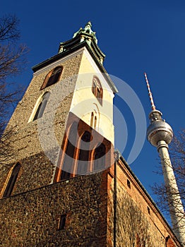 Berlin Germany St. Maryâ€™s Church and TV Tower blue sky