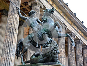 Warrior killing a lion statue at the entrance Altes Museum