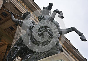 Warrior killing a lion statue at the entrance Altes Museum