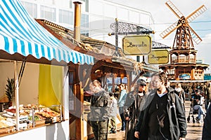 Berlin, October 03, 2017: Celebrating the Oktoberfest. People walk on the street market on the famous Alexanderplatz