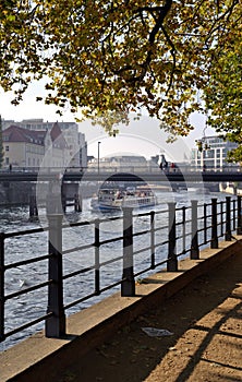 Berlin River View with a Tour Boat and Bridge