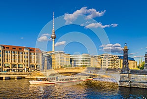 Berlin skyline with ship on Spree river at sunset, central Berlin Mitte, Germany