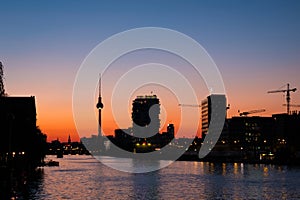 Berlin skyline sunset sky and tv tower at river spree